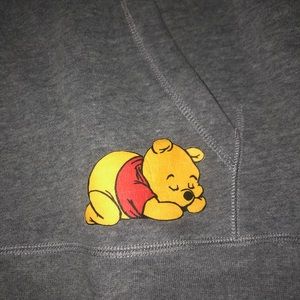 A sweat shirt with a little Winnie the Pooh